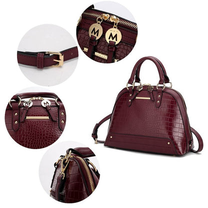 Close-up of Eggplant Nora Satchel showing gold hardware and textured croco finish.
