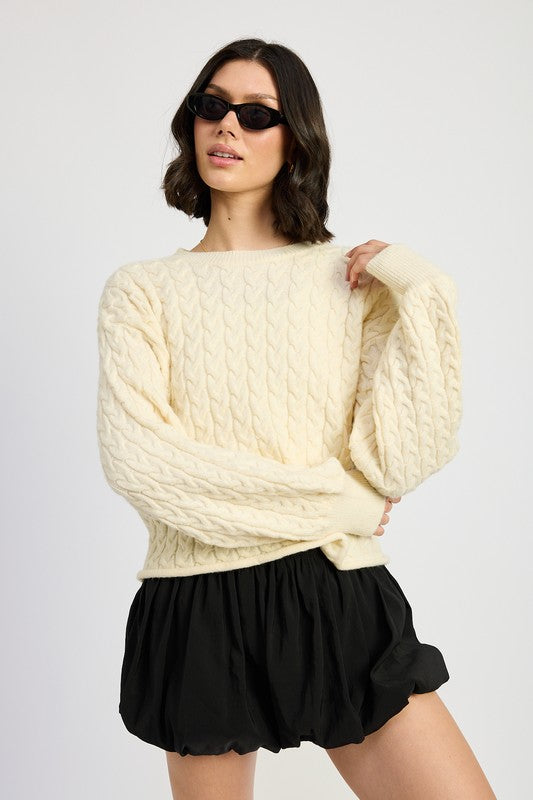 Front view of Kuuma Cable Knit Cropped Sweater in ivory with relaxed fit and crew neckline.