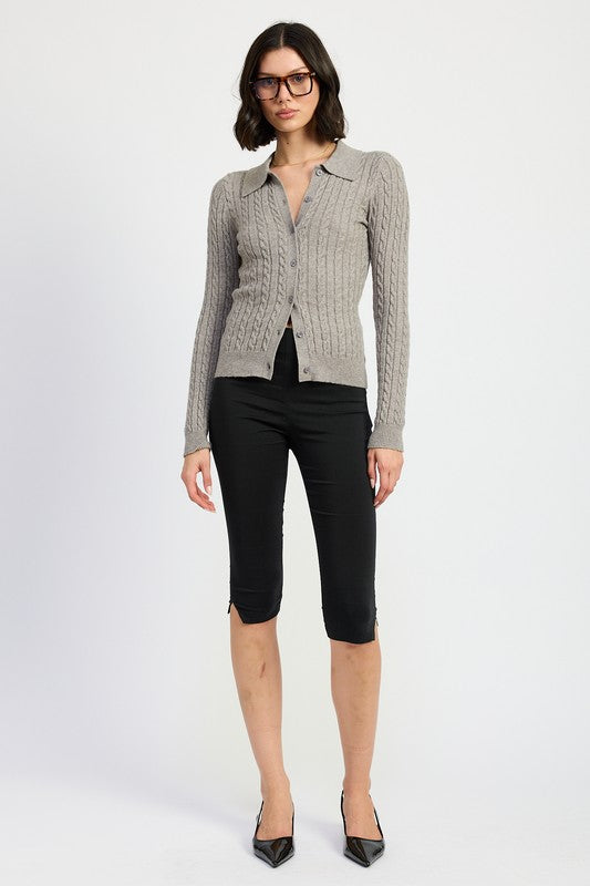 Full body view of model wearing Luiza Cable Knit Cardigan Top in gray, hands on hips.