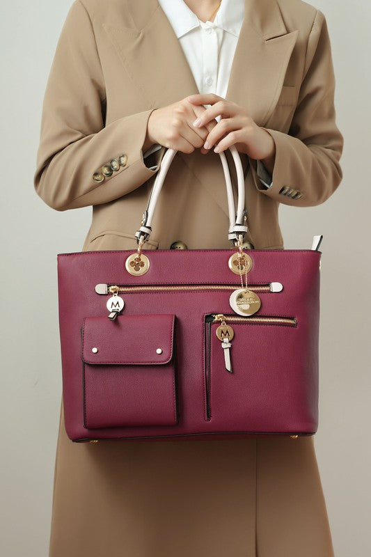 A stylish shot showcasing the Julia Satchel Bag in Wine-Blush, highlighting its structured shape, color-block design, and gold-tone hardware.