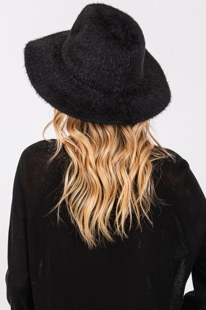 Back view of woman wearing Halsey Fuzzy Fall Fedora Hat in Black, fuzzy fabric and fedora silhouette