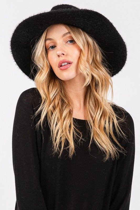 Front view of woman wearing Halsey Fuzzy Fall Fedora Hat in Black, structured crown and fuzzy finish