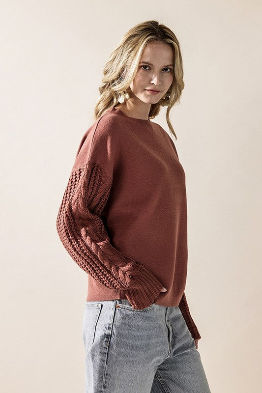 Jodie Sweater in marsala showing textured cable knit sleeves