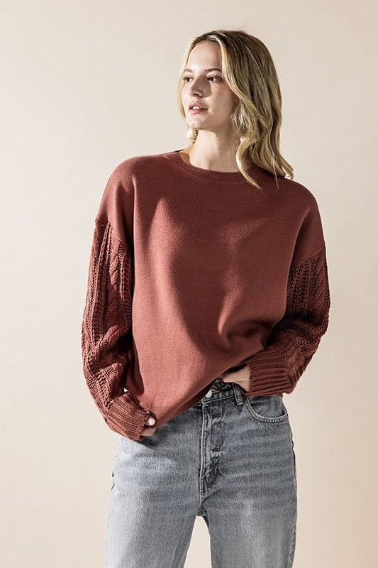 Cozy marsala sweater with round neck and cable sleeves
