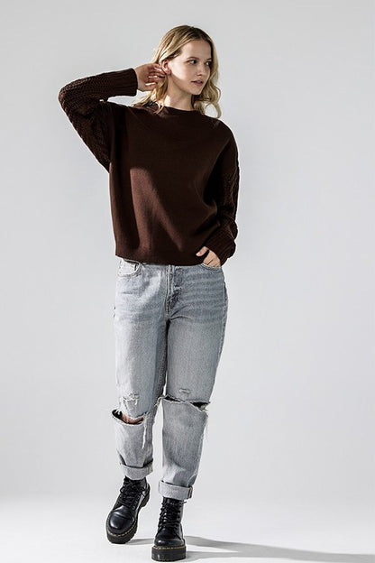 Model wearing chocolate Jodie sweater with jeans