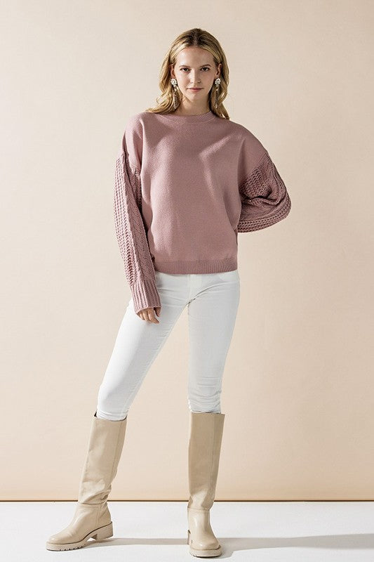 Model in mauve Jodie sweater paired with light pants