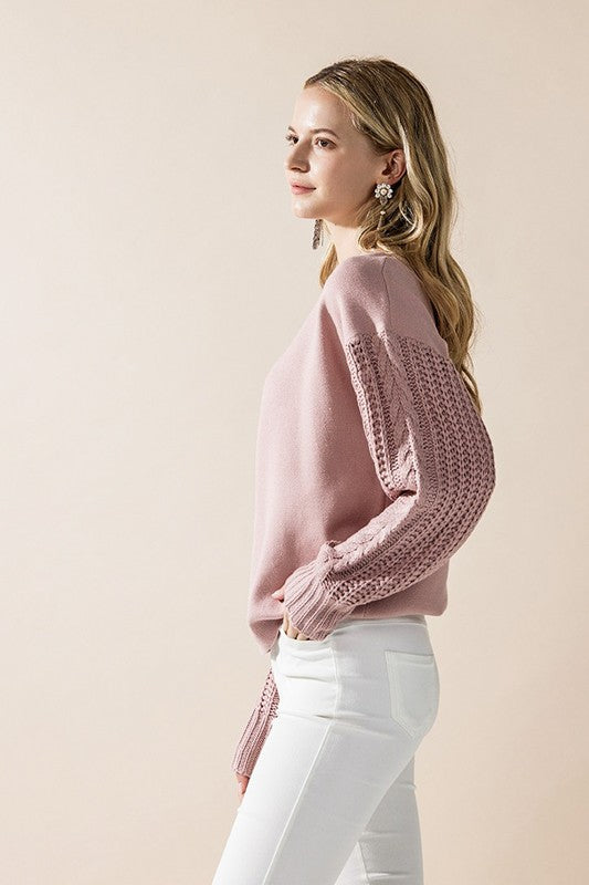 Side view of mauve Jodie sweater with cozy cable sleeves