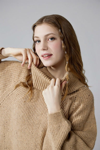 Close up view taupe confetti sweater dress with oversized turtleneck.