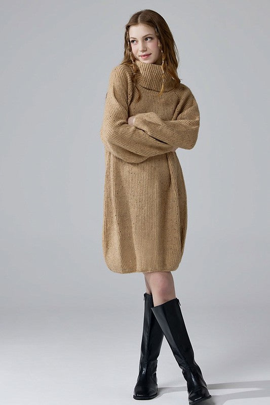 Model wearing taupe sweater dress oversized knit with balloon sleeves.