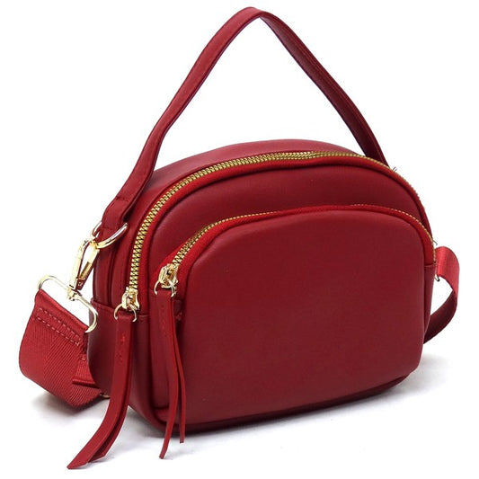 Angled view of the red Cadie Top Handle Crossbody Bag highlighting gold-tone hardware and sleek silhouette