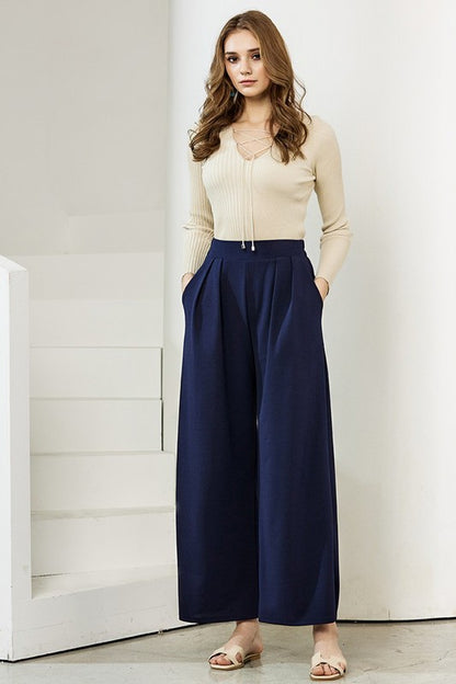 Ember Plus Size Crepe Wide Leg Pants in navy front view polished pleats