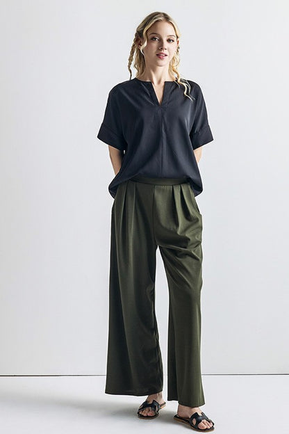 Ember Plus Size Crepe Wide Leg Pants in olive front view pleated crepe fabric