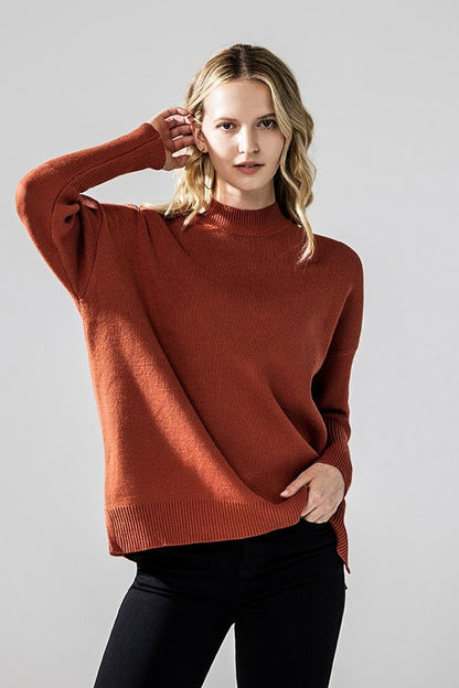 Rust Danika Mock Neck Sweater front view highlighting ribbed cuffs