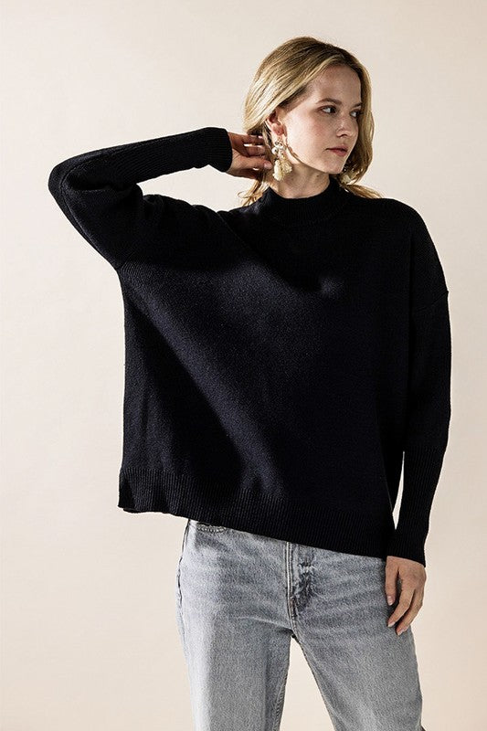 Black Danika Mock Neck Sweater front view styled with jeans