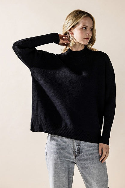 Black Danika Mock Neck Sweater front view styled with jeans