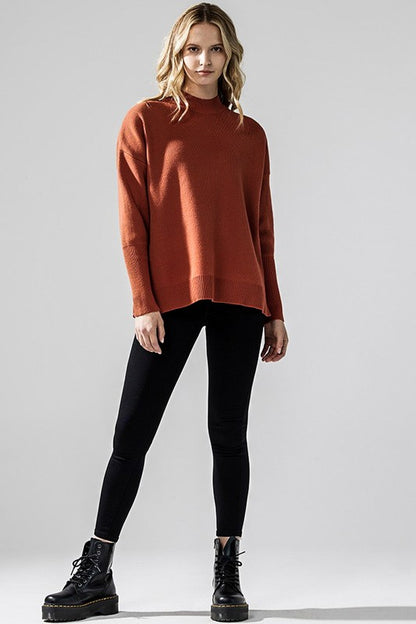 Rust Danika Mock Neck Sweater full body styled with black leggings