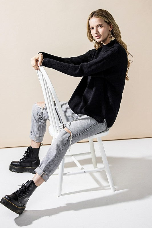 Black Danika Mock Neck Sweater side view showing relaxed fit