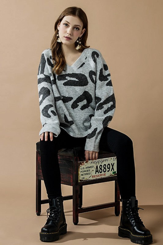 Tiana Plus Size Leopard Sweater grey fuzzy knit with relaxed sleeves and bold black print