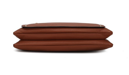Bottom view of cognac/black Aliyah shoulder bag with reinforced seams.
