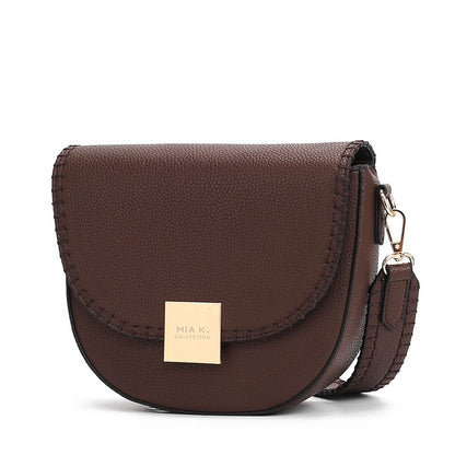Coffee Isa crossbody bag with adjustable strap and smooth vegan leather finish.
