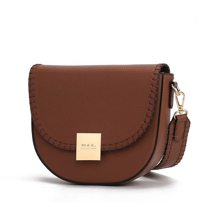 Cognac Isa crossbody bag with sleek gold-tone hardware and compact shape.