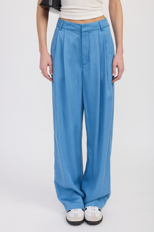 Close-up of Poppy High Waist Wide-Leg Trousers in chambray with high waist pleats