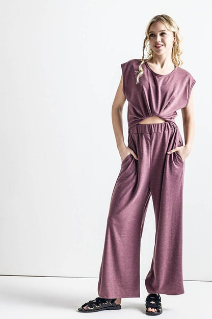 Front view of Kora Wide Leg Jumpsuit in latte with twist-front tie detail.