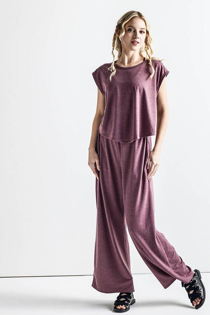Relaxed fit Kora Wide Leg Jumpsuit in latte with wide-leg pants and pockets.
