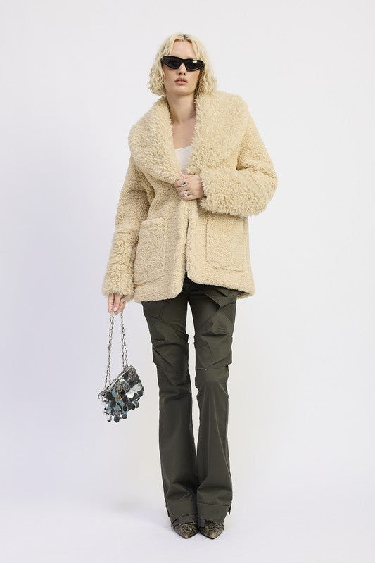 Full body view of Zephyr Fleece Jacket in taupe styled casually with trousers