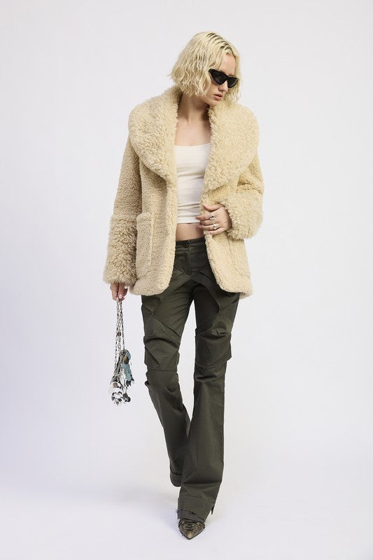 Full body view of Zephyr Fleece Jacket in taupe styled with pants and handbag