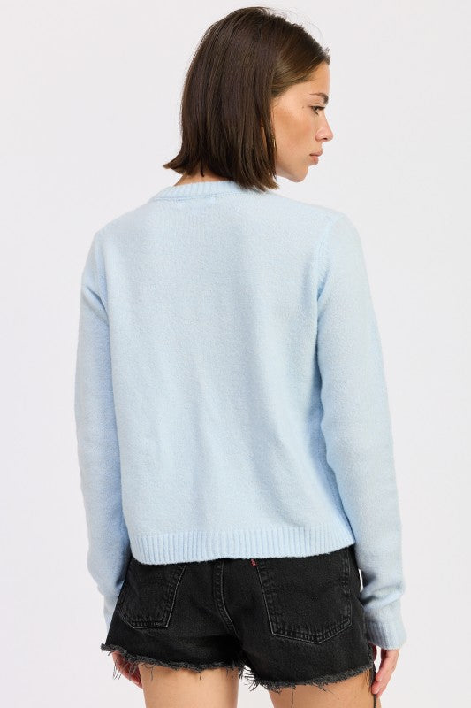Cleo Baby Blue cardigan back view ribbed knit detail.