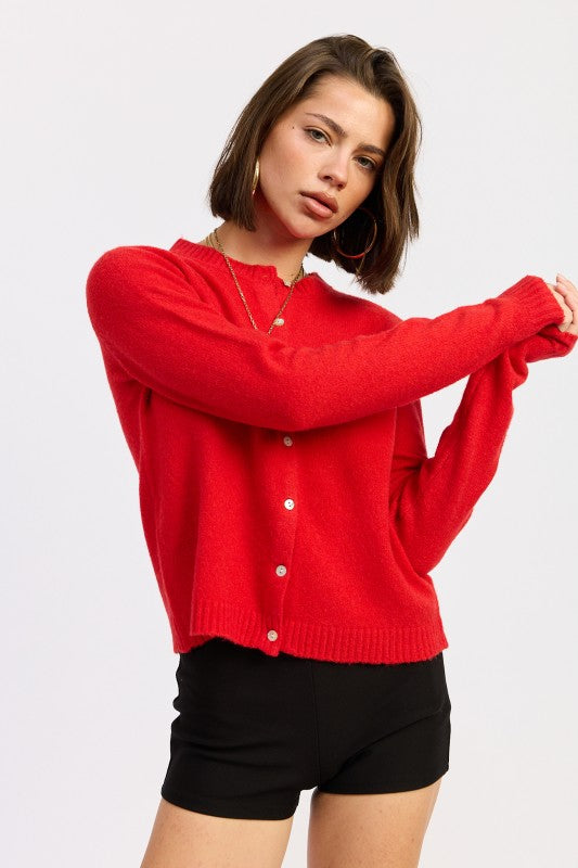Cleo Red fitted cardigan side profile long sleeves.