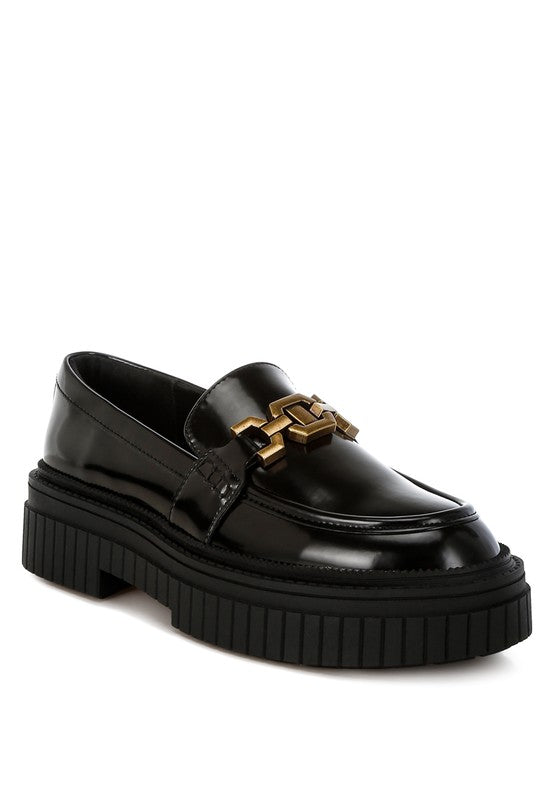 Front angle of black Grosbeak Horsebit Chunky Loafers with metallic chain.
