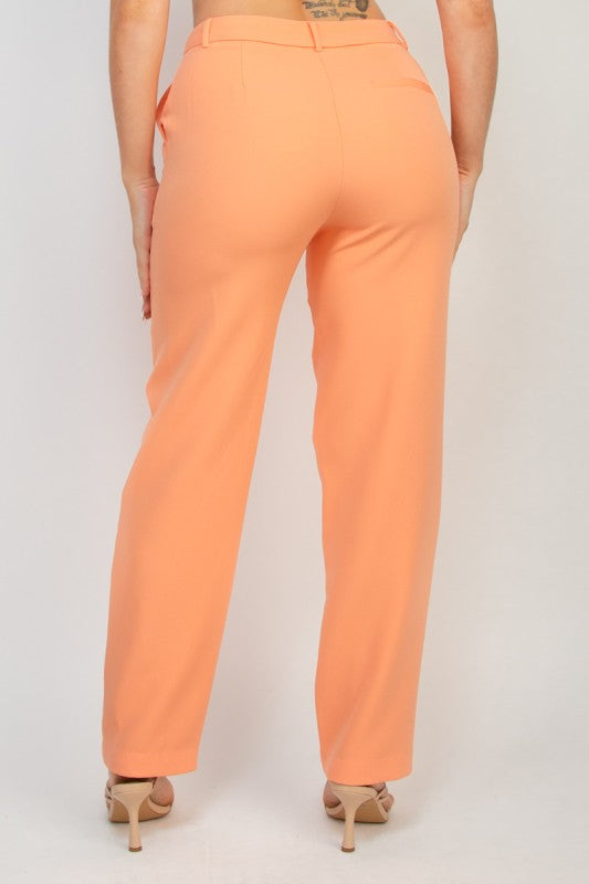 Back view of peach dressy pants, midrise fit with tailored stretch and sleek straight leg design.