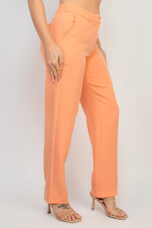 Peach midrise dressy pants with straight leg cut and side pockets, matched with button blazer.