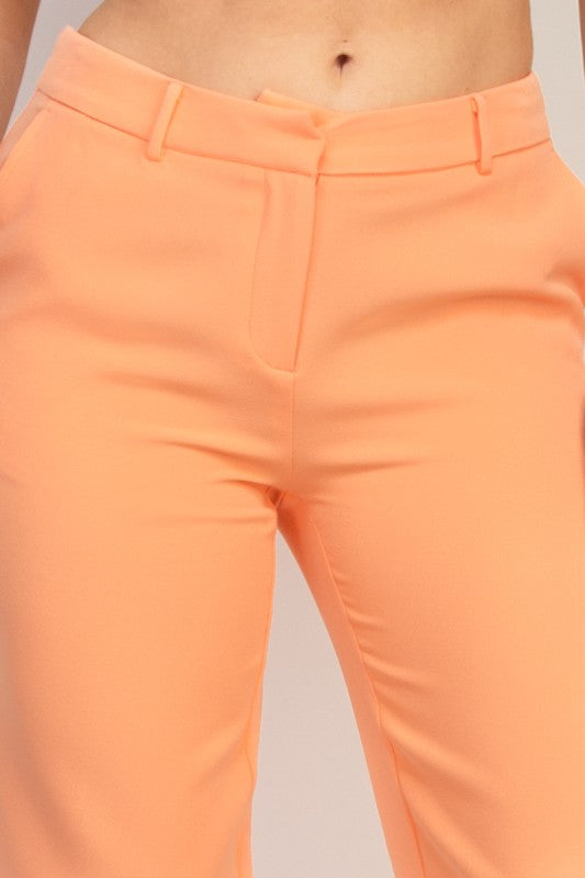 Peach midrise dressy pants with pockets, tailored stretch fit and modern straight cut for workwear. Close Up view