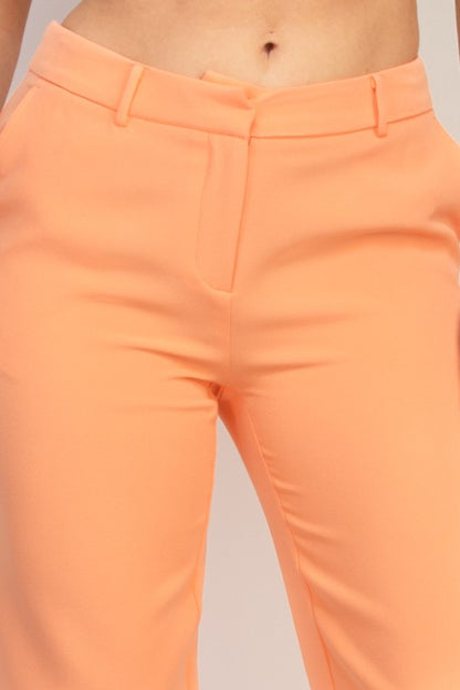 Peach midrise dressy pants with pockets, tailored stretch fit and modern straight cut for workwear. Close Up view