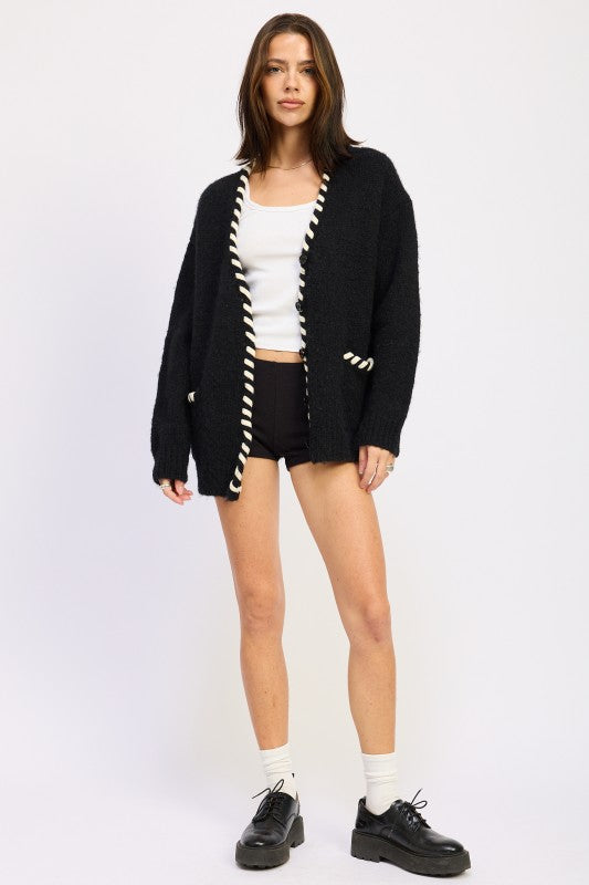 Full body front view of Londyn Trim Cardigan styled with tank and shorts.
