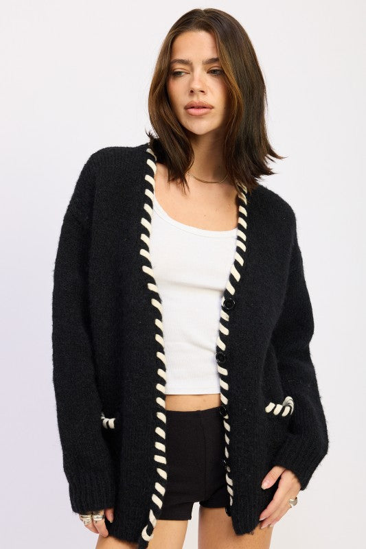 Front view of Londyn Trim Cardigan in black with button front and contrasting trim