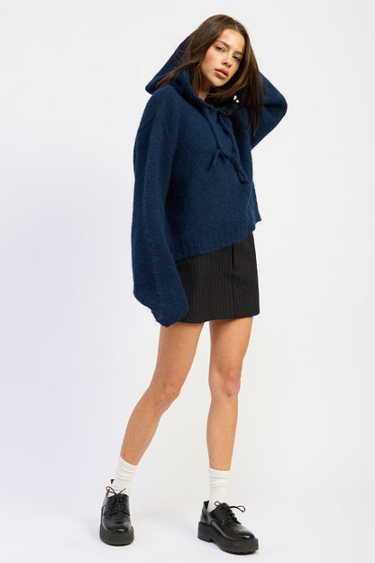 Navy Juniper Fringe Hoodie full body with hood worn up