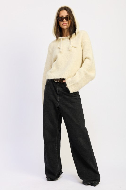Ivory Juniper Fringe Hoodie full body with hands in pockets, relaxed fit