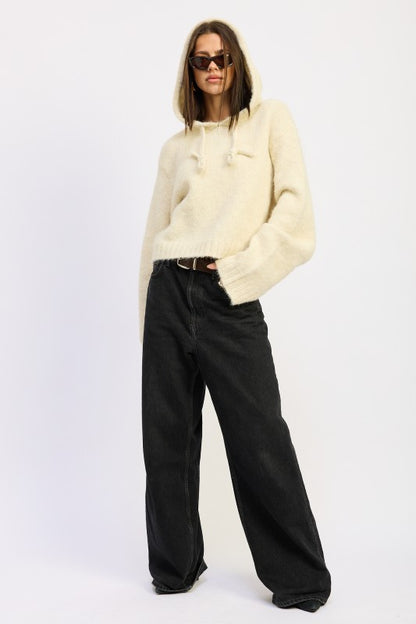Ivory Juniper Fringe Hoodie full body with hands in pockets, relaxed fit