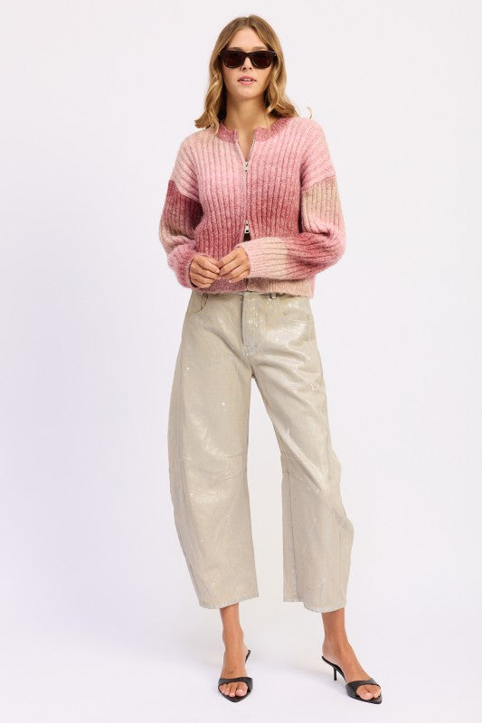 Full body shot of Lexi Ribbed Cardigan styled with sunglasses and neutral pants.