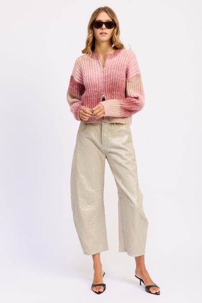 Full body shot of Lexi Ribbed Cardigan styled with sunglasses and neutral pants.