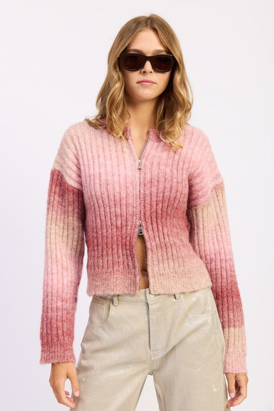Front view of Lexi Ribbed Cardigan zipped midway, showing gradient pink tones.