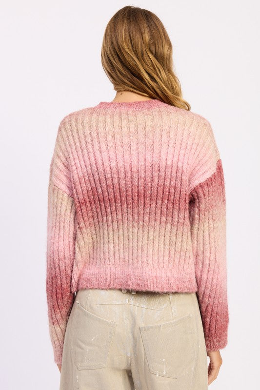 Back view of Lexi Ribbed Cardigan in rose ombré showing ribbed knit and soft fade pattern.