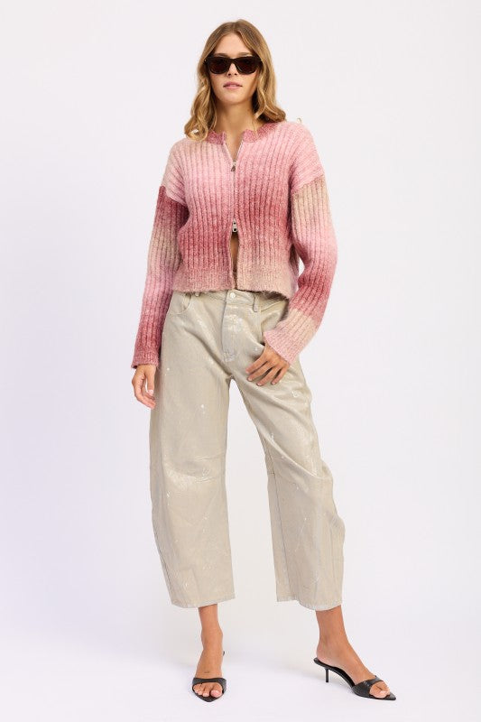 Full body view of model wearing Lexi Ribbed Cardigan and wide-leg pants with heels.