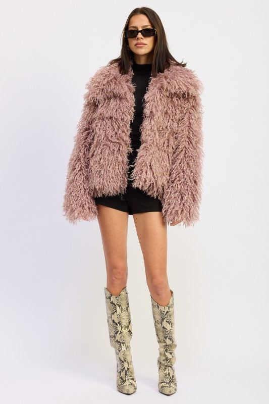 Model wearing the Chana Shaggy Faux Fur Coat in mauve, front view with collar detail