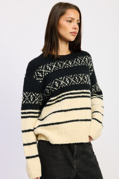 Side view of Adaline Fair Isle Striped Oversized Sweater, black cream long sleeve knit.
