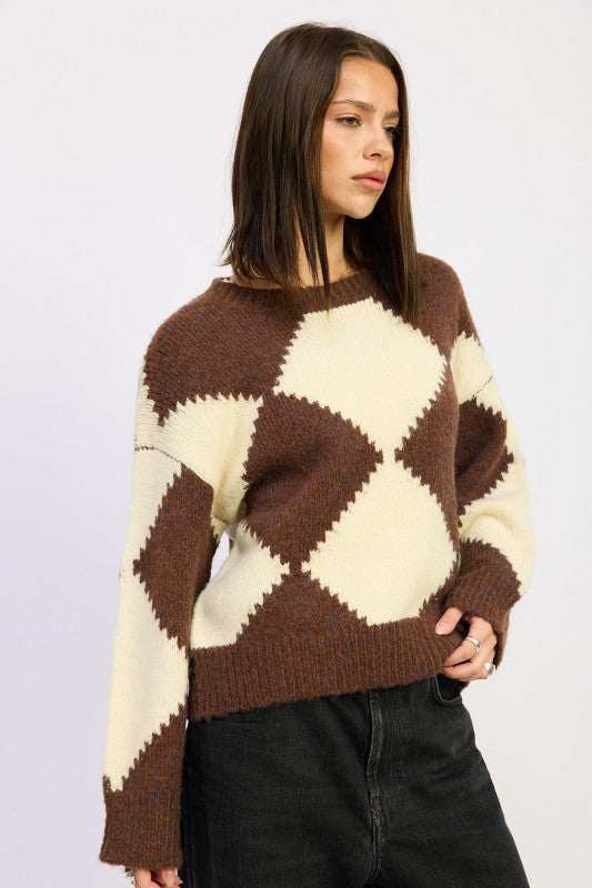 Side view of Cassidy Argyle Sweater showing sleeve detail